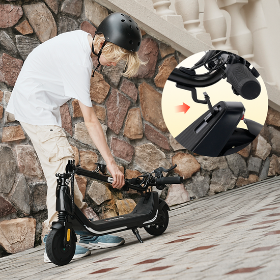 Young boy demonstrating the easy folding mechanism of the iScooter iK5 electric scooter by securing the handlebar latch into the rear fender hook, highlighting its compact portable design, lightweight frame, side kickstand, and hassle-free storage capability for effortless transportation.