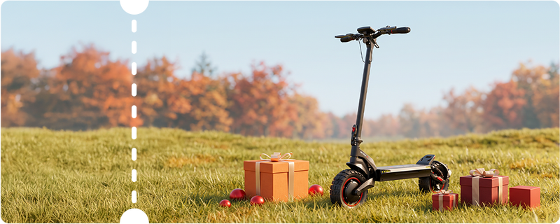 Horizontal banner layout highlighting a black iScooter iX7 Pro electric scooter resting on a grassy meadow surrounded by present boxes and golden autumn trees. Engineered for rugged environments, this high-performance e-scooter features wide off-road knobby tires, dual spring suspension, a digital handlebar interface, and side LED accent lighting for seamless all-terrain navigation.