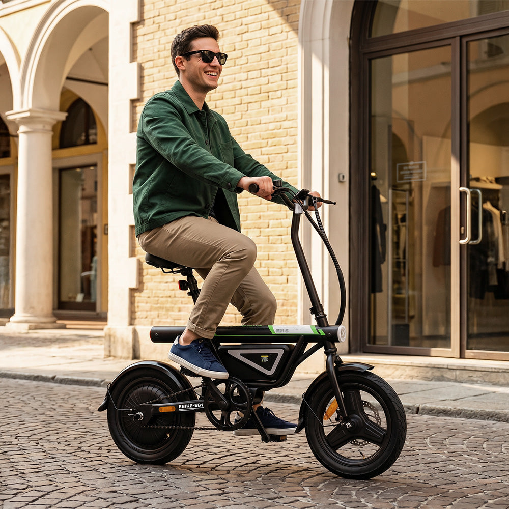 A rider cruises through a city street on the iScooter EB1S electric bike, highlighting its compact folding frame, upright riding position, integrated battery, front suspension, and sturdy wheels. Designed for convenient urban mobility, the iScooter EB1S delivers a comfortable ride, agile handling, and a space-saving design that's ideal for daily commuting and short-distance travel.
