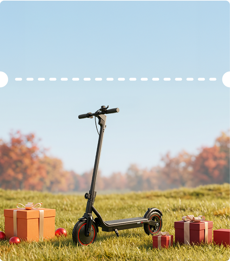 Idyllic outdoor composition displaying a matte black iScooter W5 electric scooter parked on vibrant grass amidst wrapped gift boxes against a warm autumn backdrop. Designed for dependable urban commuting, this modern e-scooter incorporates smooth pneumatic street tires with red rim accents, front fork suspension, a sturdy folding stem, and a textured foot deck for stable daily rides.